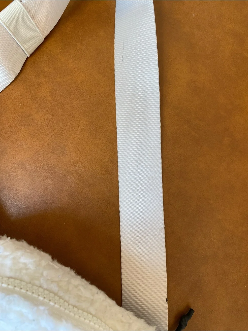 Fabletics The Belt Bag Teddy in color Bone Sherpa Crossbody Bag with Wide Strap